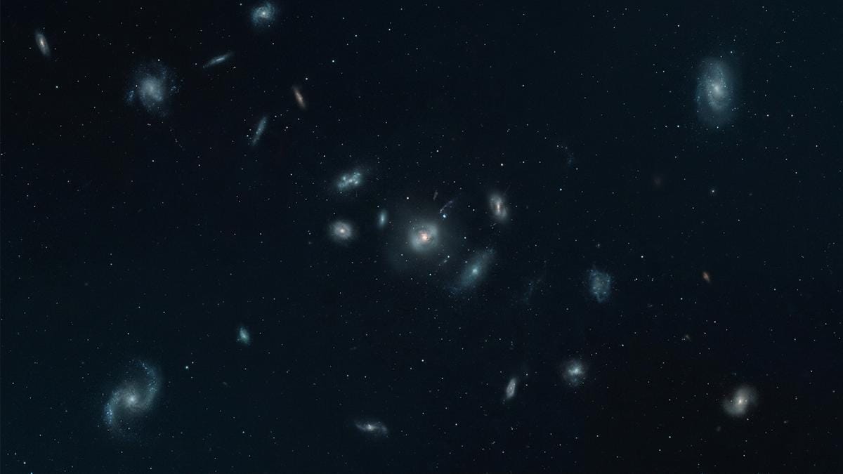 Campo profundo de galaxias lejanas observado por Webb, con varios núcleos compactos y estructuras difusas en el universo temprano.