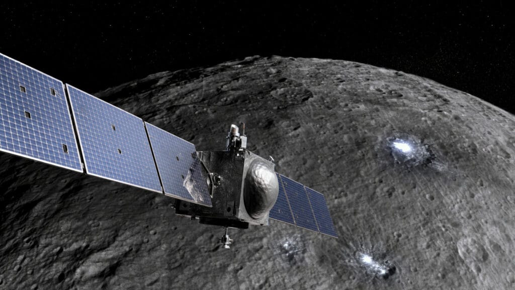 Ilustración de Ceres con sus manchas brillantes de sales sobre la superficie craterizada.